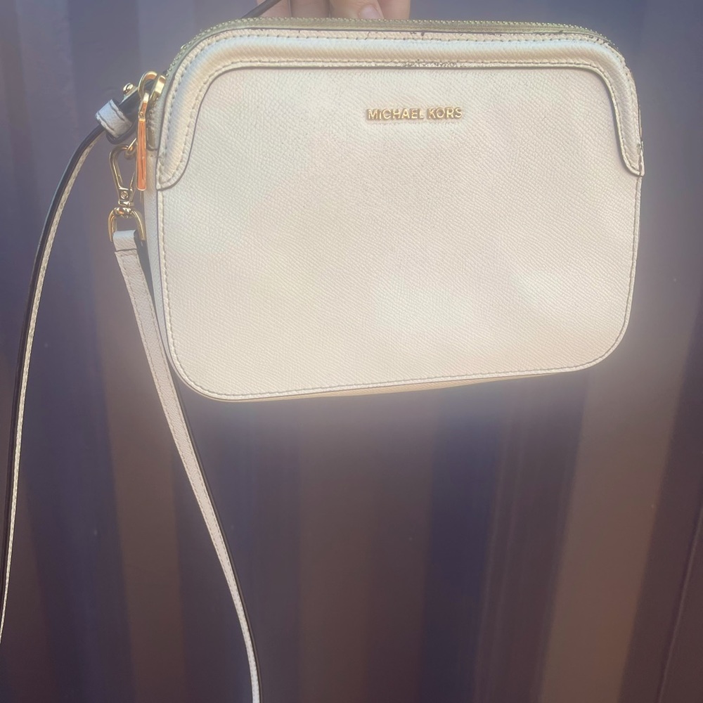 Small White crossbody Michael Kors purse in good condition!